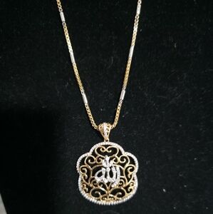 Elegant Gold and Silver Pendant Necklace